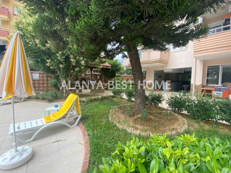 CİKCİLLİ'DE AKTİVİTELİ SİTE İÇERİSİNDE DENİZ VE KALE MANZARALI 4+1 EŞYALI DUBLEKS DAİRE